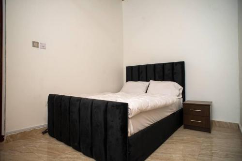 Ένα ή περισσότερα κρεβάτια σε δωμάτιο στο Lovely & Cute Condo - Close to Highway - Parking