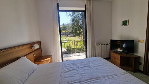 Postel nebo postele na pokoji v ubytování Hotel Montegrino Lakeview
