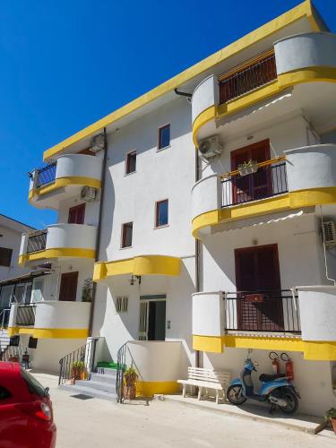 a building with a scooter parked in front of it at Le Twins -Bed and Breakfast in Tropea