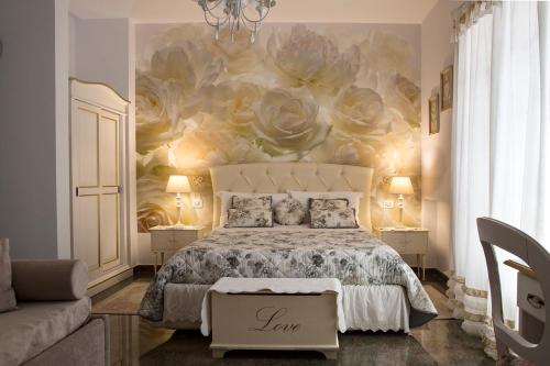 Ένα ή περισσότερα κρεβάτια σε δωμάτιο στο B&B Blanc Maison Etna Relais & Charme