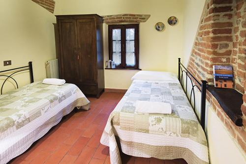 Кровать или кровати в номере Romitorio di Castiglione del Lago