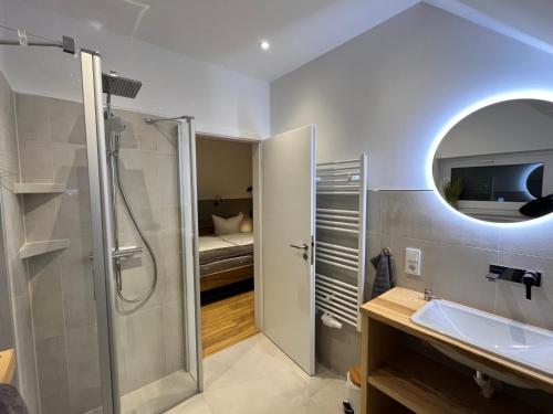 a bathroom with a shower and a sink at Zur kleinen Glocke in Burg
