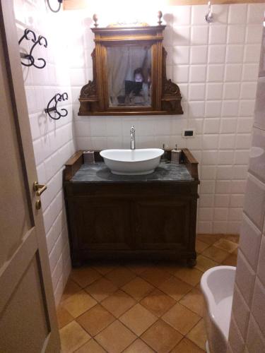 a bathroom with a sink and a mirror at Relais B in Ancona