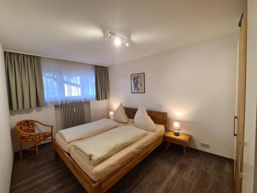 Ένα ή περισσότερα κρεβάτια σε δωμάτιο στο Bergidyll B11 Montana Haus