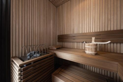 a sauna with two benches and a sink at Santre dolomythic home in Bressanone