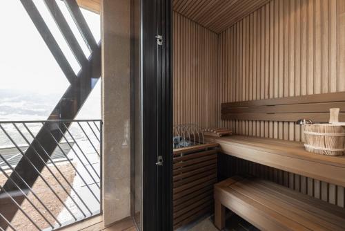 a sauna with wooden benches and a balcony at Santre dolomythic home in Bressanone