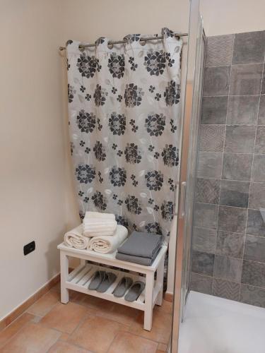 a bathroom with a shower with a shower curtain at APARTMENT KORTINE in Sečovlje