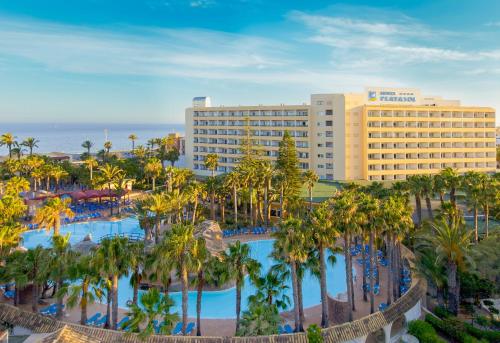 an aerial view of a resort with a pool and palm trees at Playasol in Roquetas de Mar