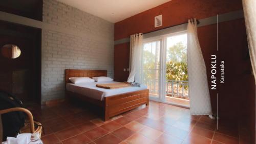 a bedroom with a bed and a large window at FernHills Homestay in Madikeri
