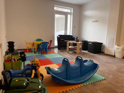 a living room with a childs play area with toys at Rezidencia Podhájska in Podhájska