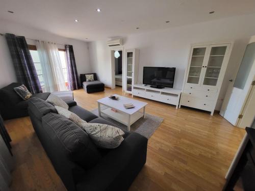 Μια τηλεόραση ή/και κέντρο ψυχαγωγίας στο Casa Matele 3 Bed Apt