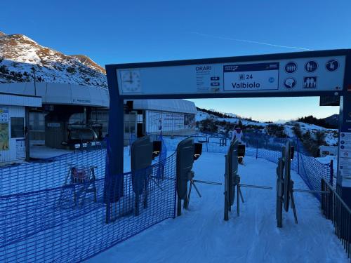 a sign at a train station in the snow at Italian Alps gateway - Huge, Comfortable place! in Passo del Tonale
