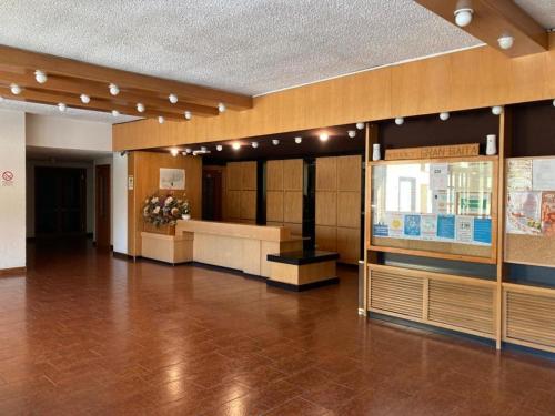 a lobby of a building with a waiting area at Italian Alps gateway - Huge, Comfortable place! in Passo del Tonale