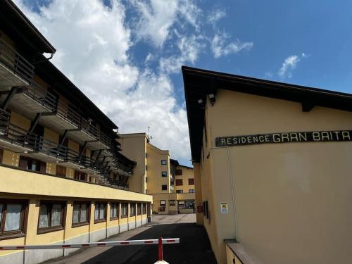 a building with a sign on the side of it at Italian Alps gateway - Huge, Comfortable place! in Passo del Tonale