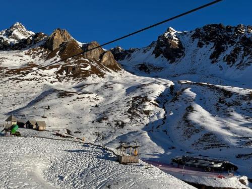 a snow covered mountain with a ski lift at Italian Alps gateway - Huge, Comfortable place! in Passo del Tonale