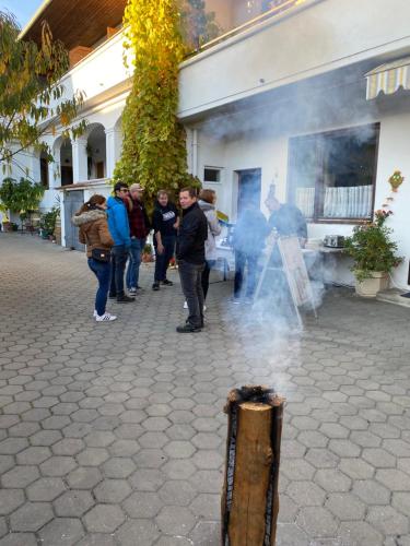 a group of people standing in front of a smoke machine at Andreashof Mörbisch in Mörbisch am See