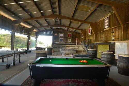 a large room with a pool table in it at Troney Valley Escapes - Owl's Den in Crediton