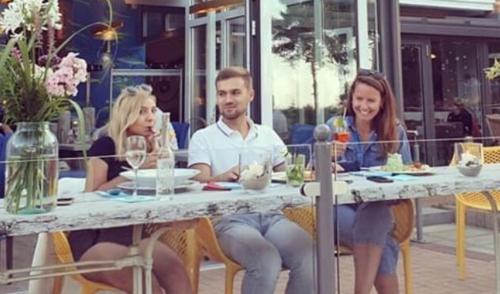 a group of three people sitting at a table at Vineta Strandhotels in Zinnowitz