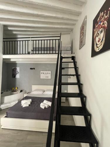 Postel nebo postele na pokoji v ubytování RC SUITE TERMINI IMERESE