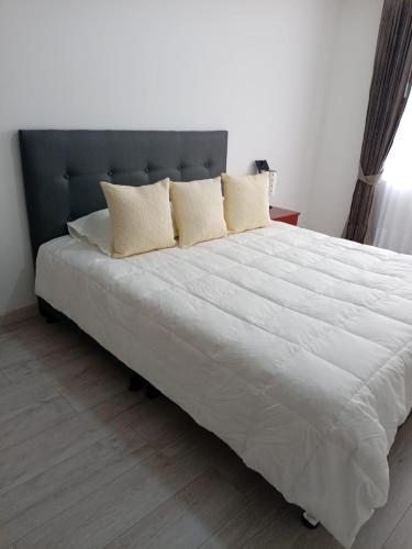 Ένα ή περισσότερα κρεβάτια σε δωμάτιο στο Apartamento para descansar