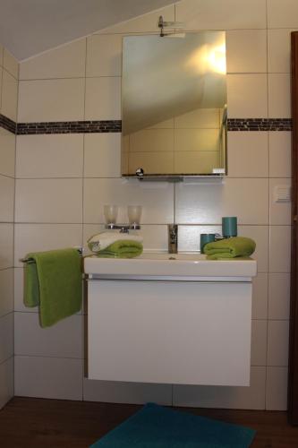 a bathroom with a sink and a mirror at Vorderweinaugut in Annaberg im Lammertal