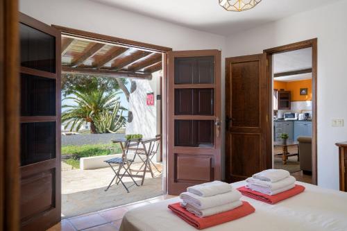 a bedroom with a bed with towels on it at Casa Los Divisos in Teguise