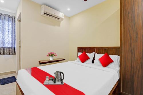 מיטה או מיטות בחדר ב-Flagship Gn Nelli Suites