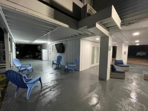 a room with blue chairs in a building at PARADISE AT SUNSET in Marathon