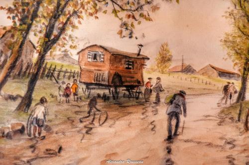 a painting of a house on a dirt road at Manoir du Bois Joly - Roulotte Art Déco in Margon