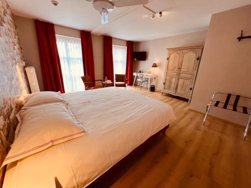 Postel nebo postele na pokoji v ubytování Hotel Het Heilig Genot