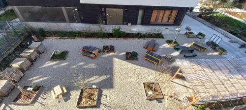 an overhead view of a patio with chairs and tables at Apparteo Strasbourg in Strasbourg