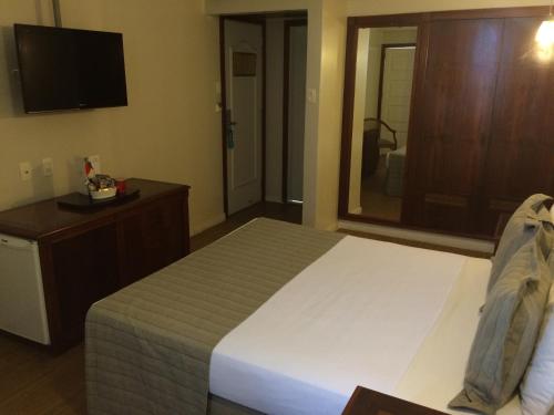 Cama ou camas em um quarto em Olinda Rio Hotel