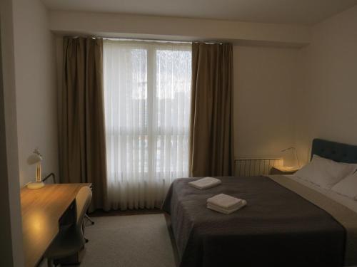 Ένα ή περισσότερα κρεβάτια σε δωμάτιο στο Premium NB Apartment - Belgrade Waterfront