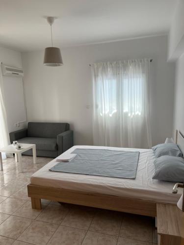 A bed or beds in a room at G.S Ialysos Holiday Apartment