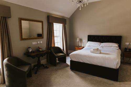 Ένα ή περισσότερα κρεβάτια σε δωμάτιο στο Healing Manor Hotel