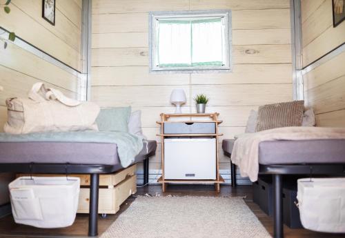 Säng eller sängar i ett rum på Kieler Woche Lodge Camp
