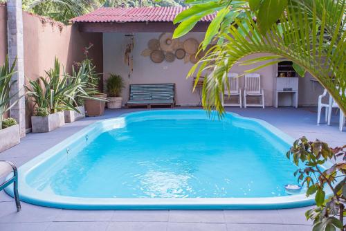 a large blue swimming pool on a patio at Pousada Castelinho in São Sebastião