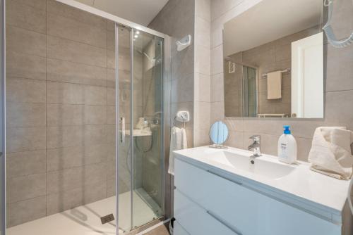 a bathroom with a shower and a sink at Countess Attic E at Alcudia Beach in Alcudia