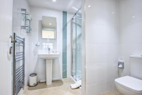 a bathroom with a toilet and a sink and a shower at Rooms At Aysgarth ,Town Ends in Aysgarth