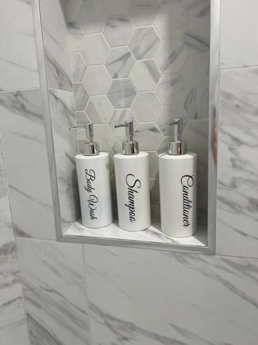 three white towels sitting on a shelf in a bathroom at Perfect place to enjoy the city or just relax in Chicago
