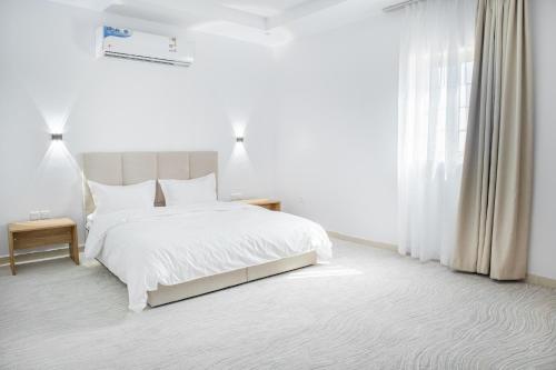 Ένα ή περισσότερα κρεβάτια σε δωμάτιο στο Luxury and Modern Hotel Apartments in Mudhainib - Nozol Noor 3