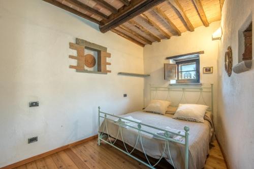Katil atau katil-katil dalam bilik di Casale Rosennano - Loggia
