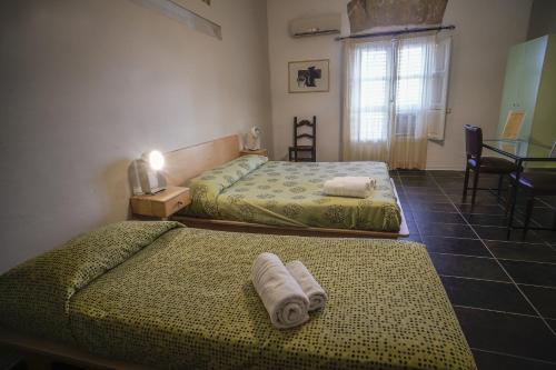 Posteľ alebo postele v izbe v ubytovaní Casa Lerux