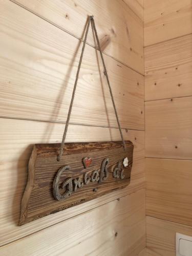 a sign hanging on a wall in a room at Blockhaus Waldspiel -Adults Only in Ratten