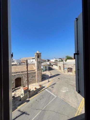 a view of an empty street from a window at KINGS SQUARE Holiday Apartments in Polis Chrysochous