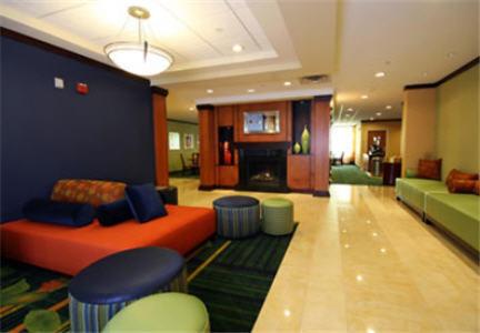 a living room filled with furniture and a large window at Fairfield Inn and Suites White River Junction in White River Junction