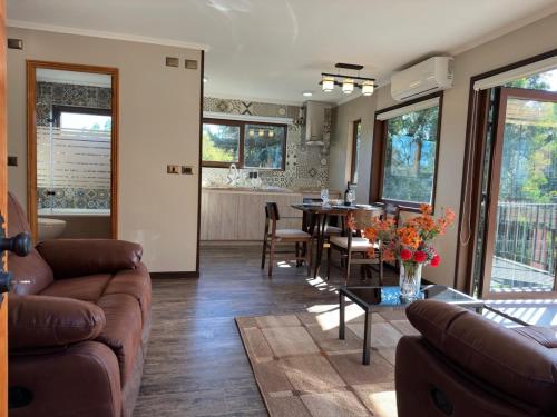 a living room with a couch and a table at Mirabosque aparment Ejecutivos 8 in Osorno