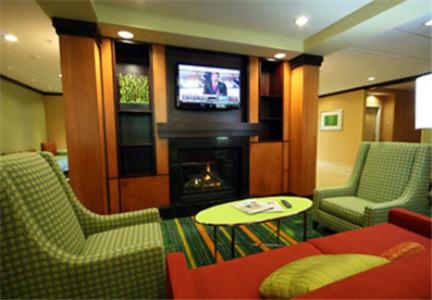 a living room filled with furniture and a tv at Fairfield Inn and Suites White River Junction in White River Junction