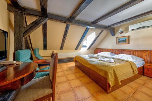 Postel nebo postele na pokoji v ubytování Betlem Club Hotel