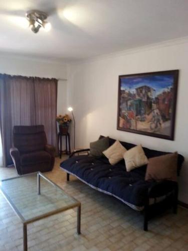 a living room with a couch and a coffee table at Yzerzee 2 in Yzerfontein